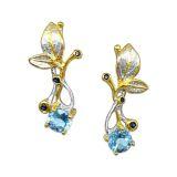 Śliczne srebrne kolczyki z topazem i szafirem